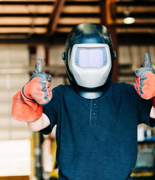 a-child-wears-a-welding-helmet-and-welding-gloves-2024-09-12-21-31-44-utc a-child-wears-a-welding-helmet-and-welding-gloves-2024-09-12-21-31-44-utc